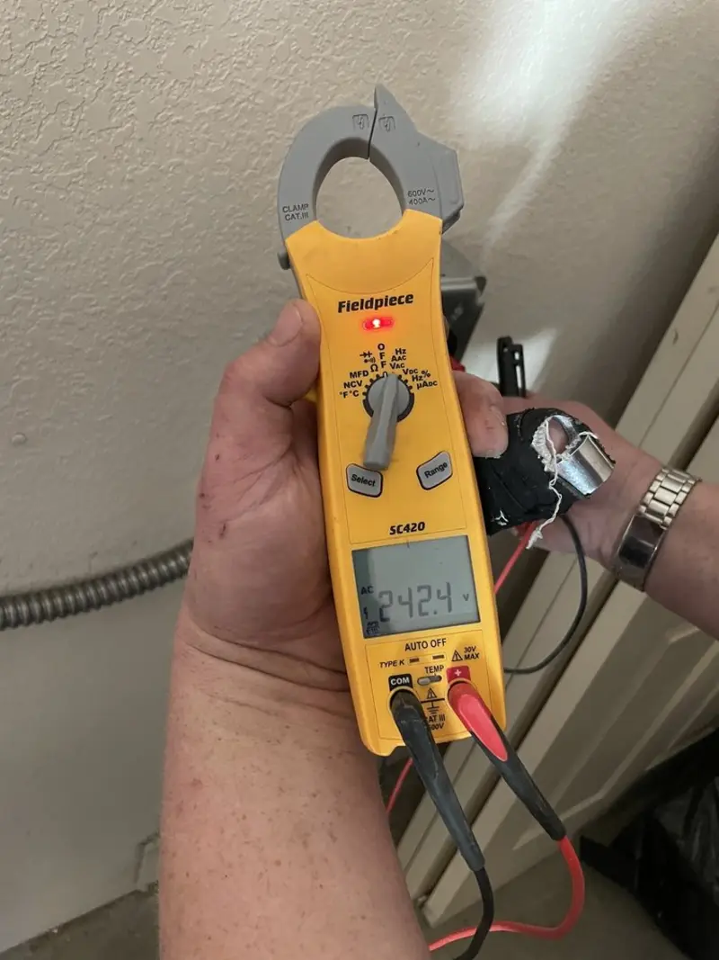 Voltage testing with clamp meter during Recessed Lighting Installation in Parlier